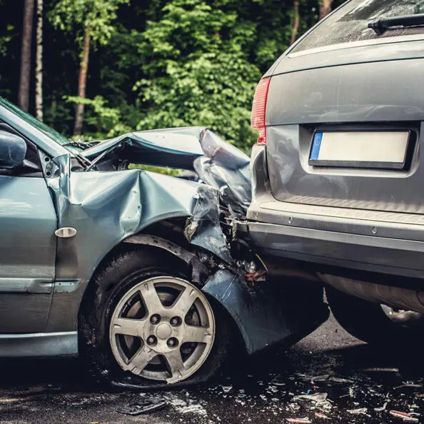 Close up smached cars on a road.