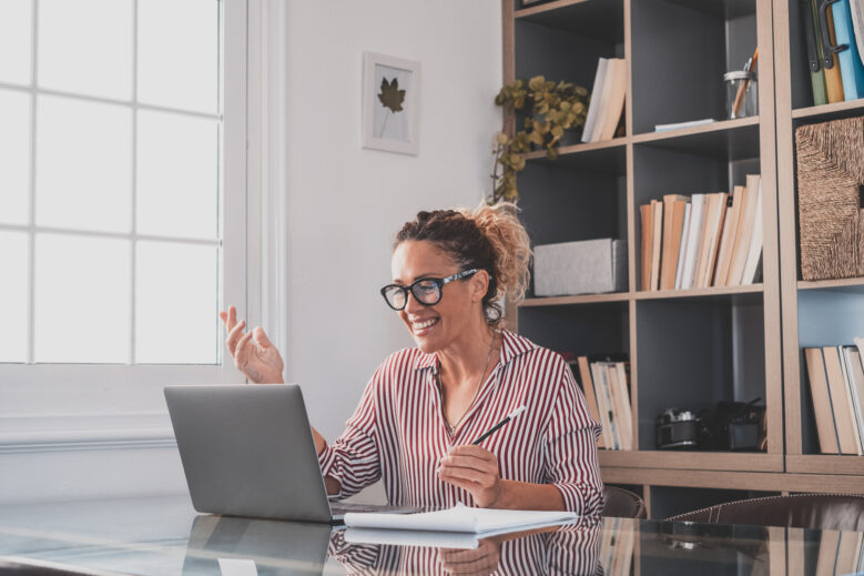 One young woman working at home in the office with laptop and no