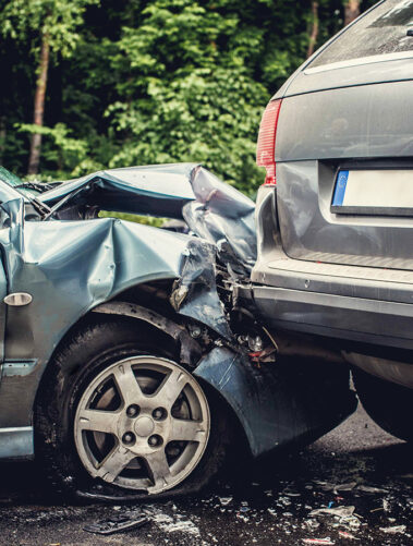 Close up smached cars on a road.