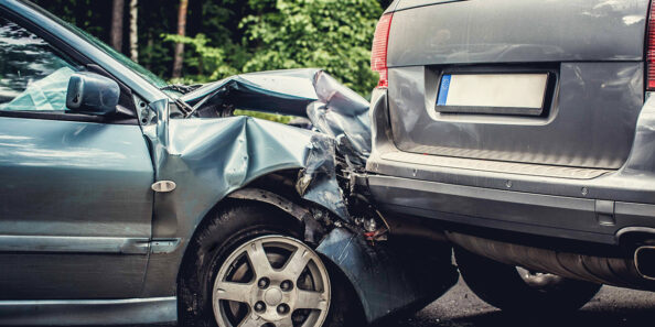 Close up smached cars on a road.